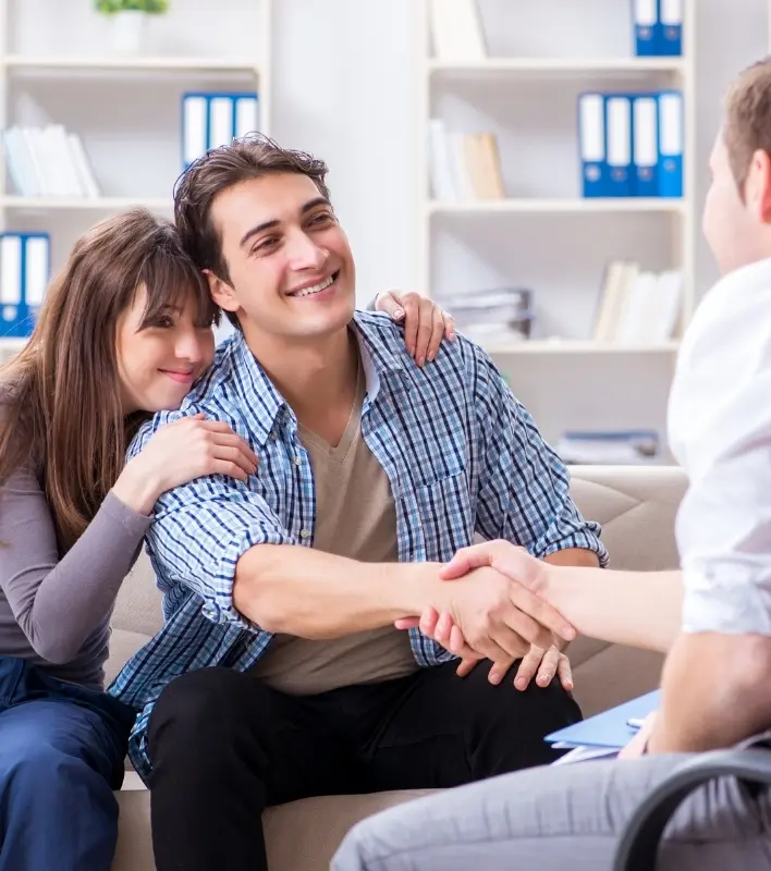 Couple Shaking Hands With Therapist