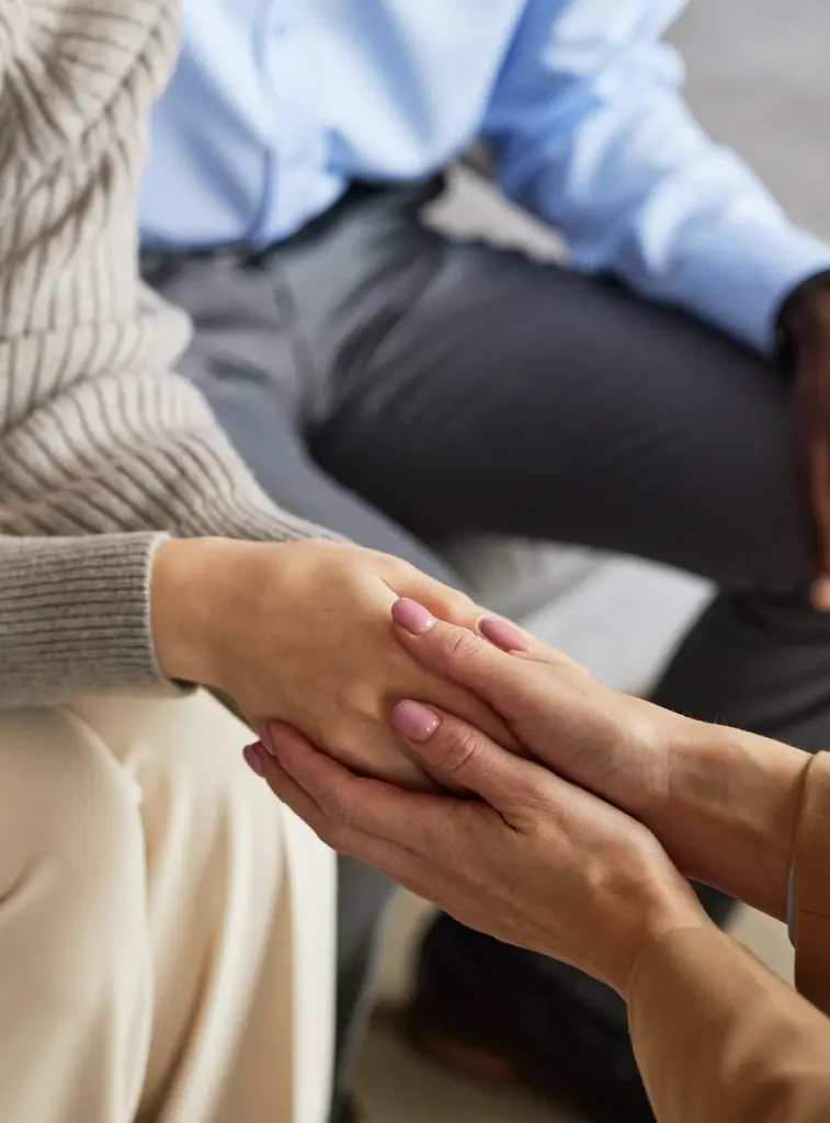Holding Hands In A Supportive Therapy Session
